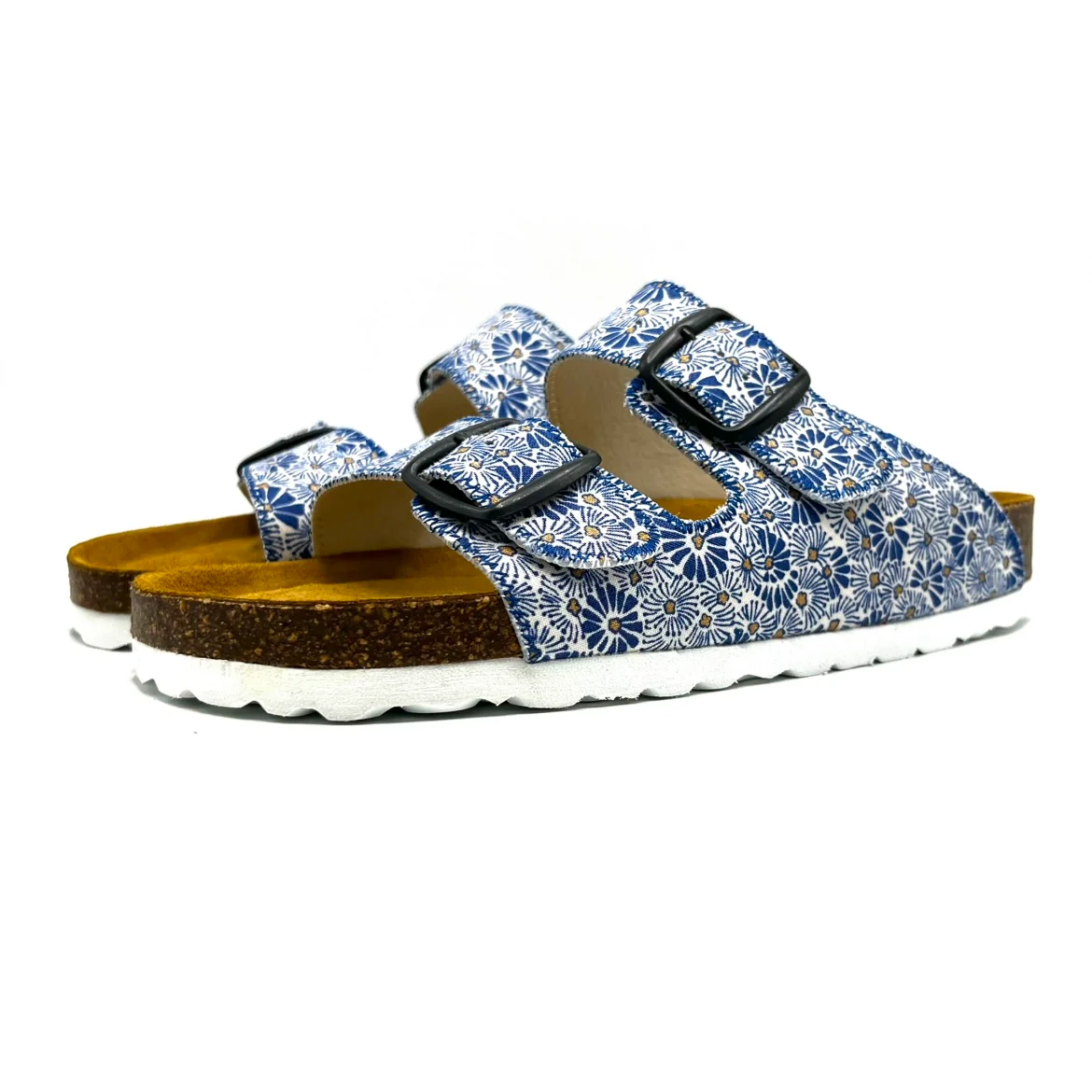 Pair of blue floral sandals with cork soles on a white background