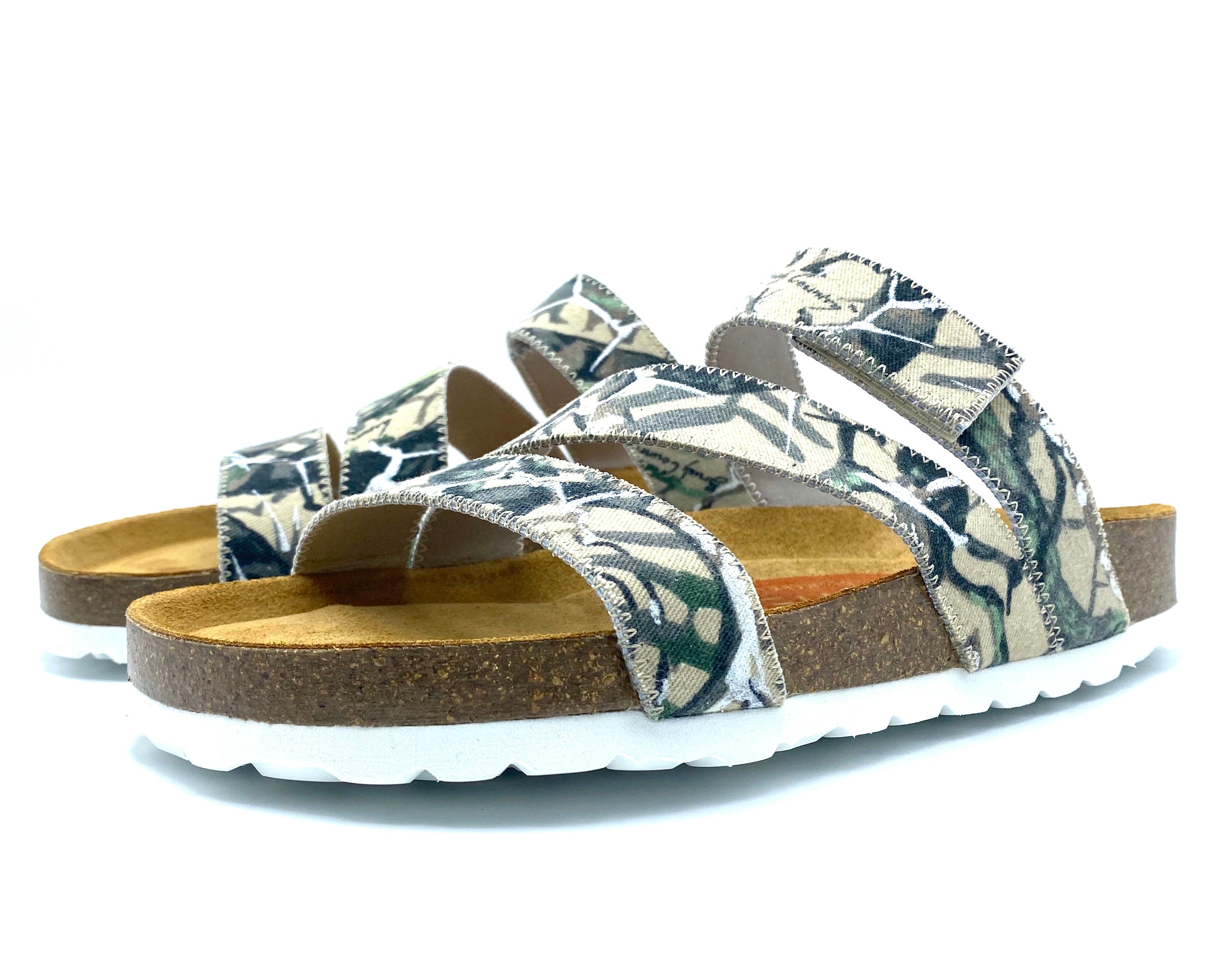 Pair of sandals with floral pattern on a white background